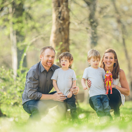 In a Sunlit Meadow, Erin Scholtes Poses with Family