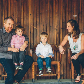 On a Rustic Wooden Porch, Erin Scholtes Sits with Family